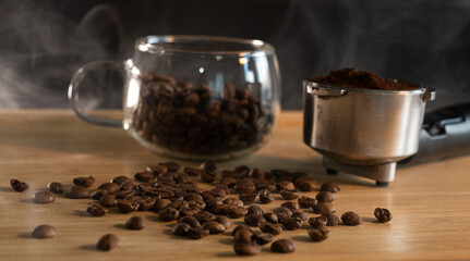 Coffee Beans, Ground Coffee, and Portafilter on Wooden Table with Steam – Barista Brewing and Espresso Concept