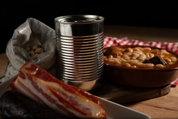 Preparing a traditional bean stew with ingredients