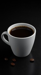 A white ceramic coffee cup filled with dark coffee, placed on a black surface. Coffee beans are scattered around the cup.