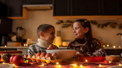 Children baking together in a cozy kitchen during the holiday season