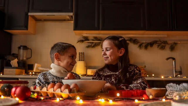 Children baking together in a cozy kitchen during the holiday season