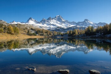 Fototapeta premium Mountain range reflecting in blue lake