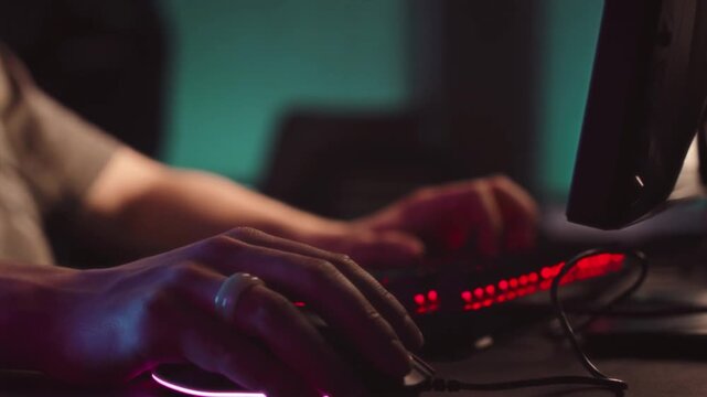 Intense Late-Night Gaming Setup with Glowing RGB Lights