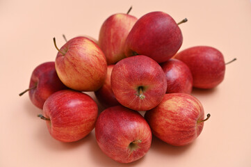 A bunch of red apples on a light background close-up