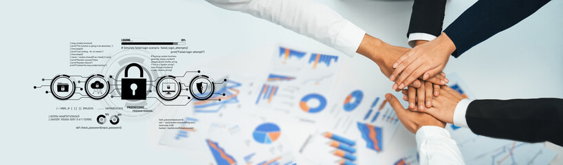 Obraz premium Team Collaboration and Cybersecurity Concept with Hands Stacking on Documents Featuring Graphs and Lock Symbols for Business Partnership and Protection Trope.