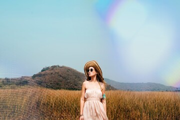 A caucasian woman is enjoying the summer time