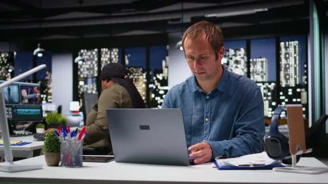 Business manager in modern workplace sharing insights and reports, focusing on data visualization for efficient resource allocation. Successful company administration and management. Camera A.