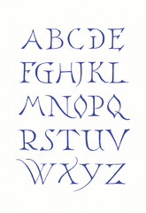 Hand-drawn alphabet created with ink and pen. Ornamental blue lettering in artistic calligraphic style on white background.