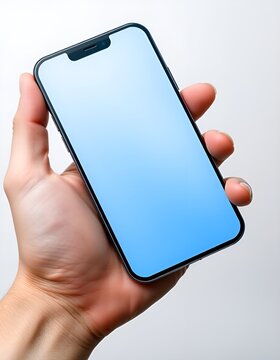 Hand holding modern smartphone with empty screen. Mobile phone mockup for app developers and designers. Ideal for showcasing digital products and mobile applications.
