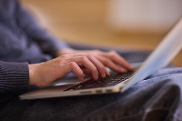 Determined individual with cerebral palsy immersed in educational activities indoors, Courageous woman with cerebral palsy concentrates on studying at home with dedication