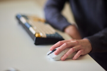 Professional hand controls computer, Worker actively managing digital presentation at desk, Business professional guiding mouse during focused digital workflow session