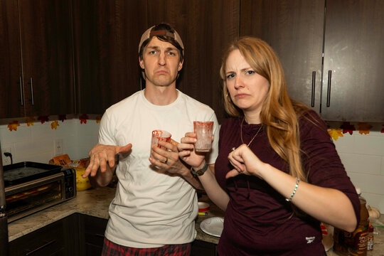 joyful autumn celebration, lively party with friends enjoying drinks in warmly decorated autumnal kitchen - Powered by Adobe