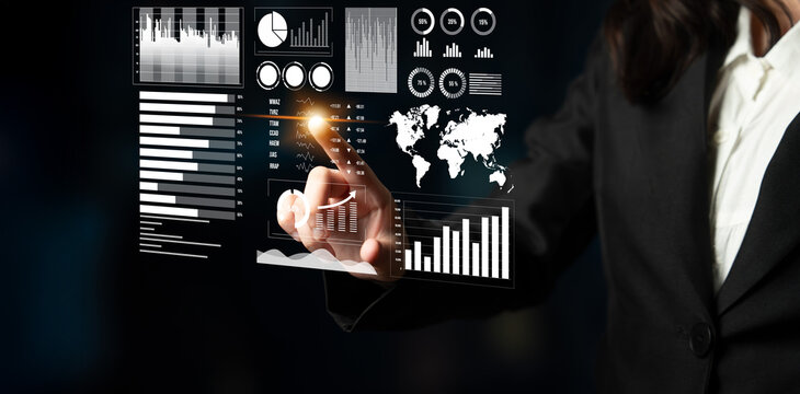 A business professional engages with advanced digital data visualizations, highlighting innovation in data analysis and strategic insights within a modern office. Impute