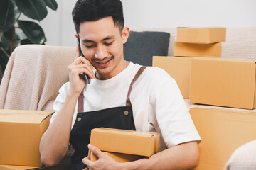 Startup small business owner packing boxes for online customer delivery. Entrepreneur managing e-commerce orders, shipping parcels, and running home-based business operations from home office.