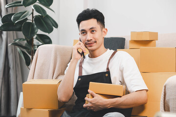 Startup small business owner packing boxes for online customer delivery. Entrepreneur managing e-commerce orders, shipping parcels, and running home-based business operations from home office.