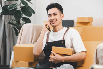 Startup small business owner packing boxes for online customer delivery. Entrepreneur managing e-commerce orders, shipping parcels, and running home-based business operations from home office.