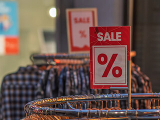 Retail Sale Signage with Discounts at Clothing Store