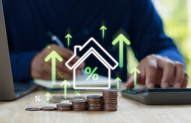 Real estate investment growth percentage coins house finance property market financial strategy. Businessman analyzing real estate investment growth on laptop with virtual house icons and rising graph