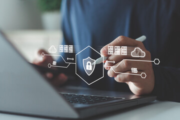 Concept of cloud computing, data management and technology innovation. Businessman using laptop with digital cloud storage interface, data upload and file sharing system for online business.