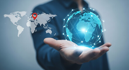 Man holds glowing digital earth globe in hand with a location pin on a world map, symbolizing global network connections and international business.