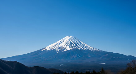 Mount fuji with snow cap stands under clear blue sky in japan