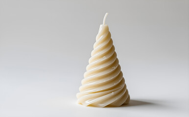 Cone-shaped spiral candle in ivory, ideal for festive decorations. Emphasizes layered twist for holiday and party styling.