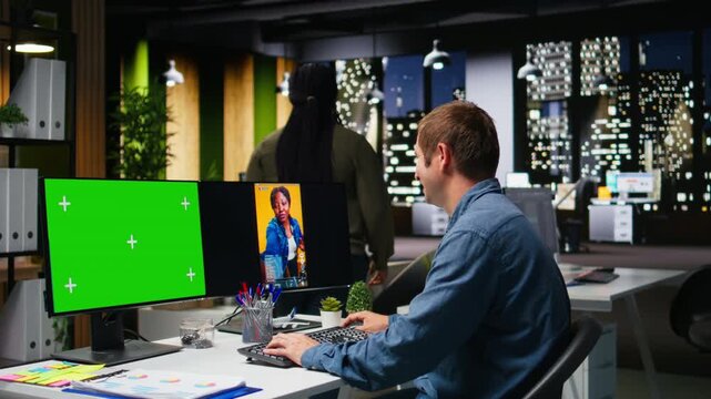 Mockup next to marketing analyst editing smartphone video footage on dual monitors, applying professional tools for video creation. Targeting algorithm shifts for engagement and reach. Camera A. - Powered by Adobe