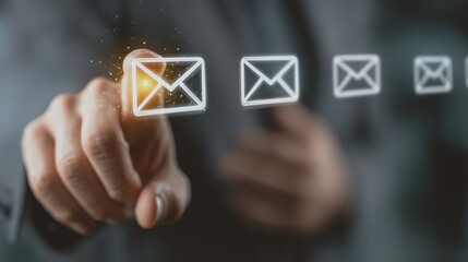 Digital email message sending concept. A finger presses on an envelope on the screen.