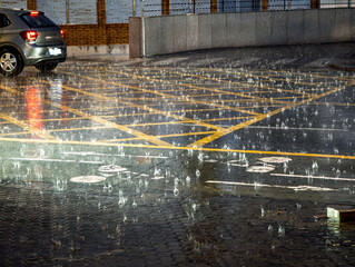 Heavy rain creates ripples on Seville bike lane and roadway