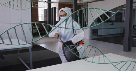 Spraying PPE worker operating backpack sprayer and moving chair in open office with DNA overlays
