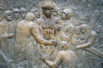 Station X: Jesus is stripped of his garments (Division of robes). The Way of the Cross on Mount Križevac (the Cross Mountain) in Medjugorje.