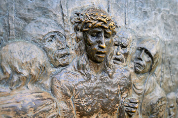 Station X: Jesus is stripped of his garments (Division of robes). The Way of the Cross on Mount Križevac (the Cross Mountain) in Medjugorje.