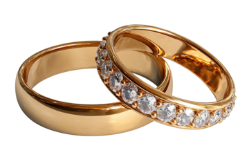 Two gold rings, one plain, one jeweled, on black