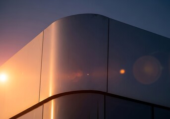 Modern architectural reflection catching the last rays of the evening sun