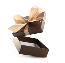 Open gift box with beautiful lid in air against white background