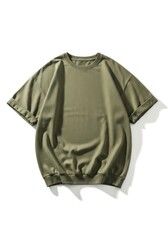 An olive green oversized t-shirt with rolled sleeves and a gathered hem laid flat against a white background