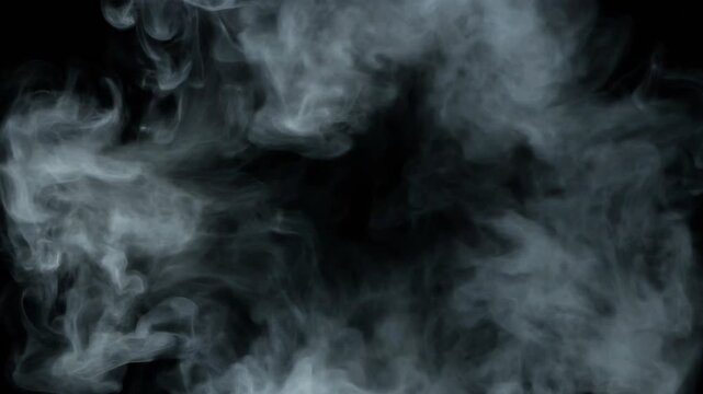 Ring of white smoke slowly expanding against a stark black background