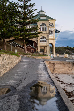 The Indiana Tea House of Cottesloe Beach, reflected in a rain puddle.