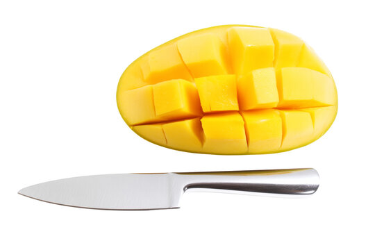 Halved mango with grid-like cut on silver knife, isolated on transparent background - Powered by Adobe