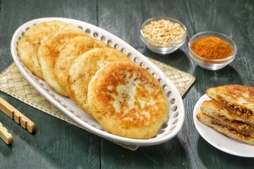 Hotteok is a pancake filled with bean paste, sold as a South Korean snack food