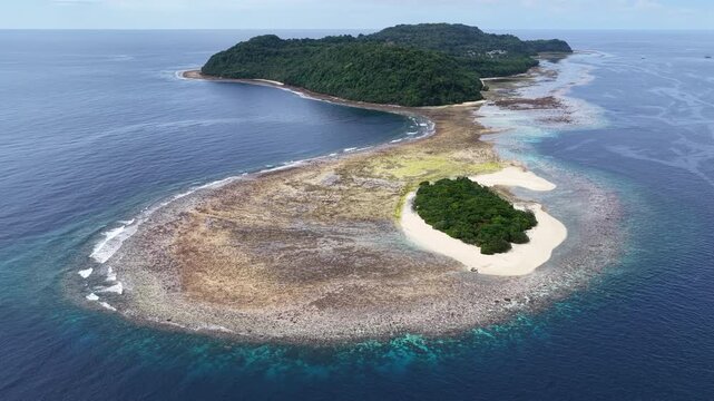 A beautiful coral reef fringes the island of Rhun in the remote Banda Islands of Indonesia. This region is home to spectacular marine biodiversity and is a destination for divers and snorkelers.