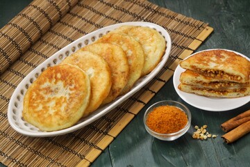Hotteok is a pancake filled with bean paste, sold as a South Korean snack food