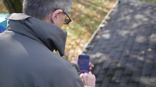  Roofing Inspecter Taking Photos of Moss on Roof