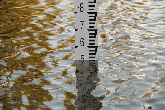 Flood depth gauge in deep water in a frequently flooding area.