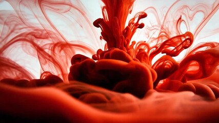 Vibrant Red Ink Swirls in Water Abstract Motion.