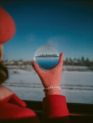 Modern Traveler Discovering Urban Wonders Through Crystal Ball Premium Winter Travel for Inspiring Marketing Content