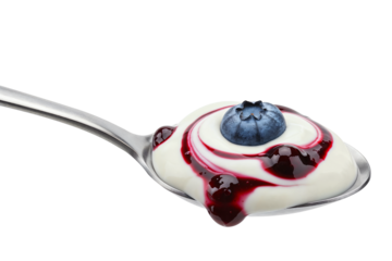 A vibrant blueberry swirl and a fresh blueberry nestled in creamy yogurt on a silver spoon.