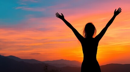 Fototapeta premium A silhouette of a woman with arms raised against a vibrant sunset, symbolizing freedom and joy in a serene landscape.