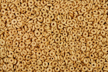 Wholegrain breakfast cereal hoops detail background texture