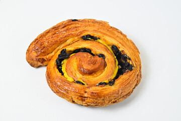 Close up view of raisin roll isolated on white background. Clipping path. Fresh, brown.